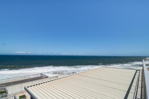 a view of the ocean from a pier at Happy Escape in Umdloti