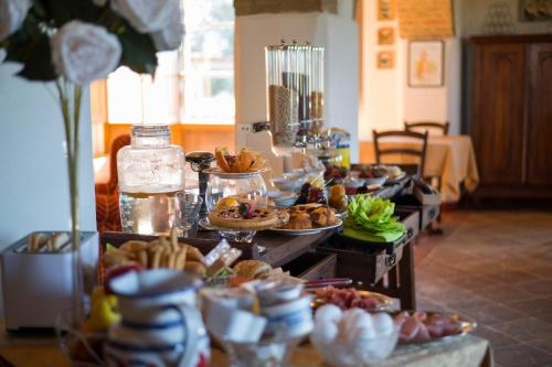 a buffet with many different types of food on at Podere Cerciano in Radicondoli