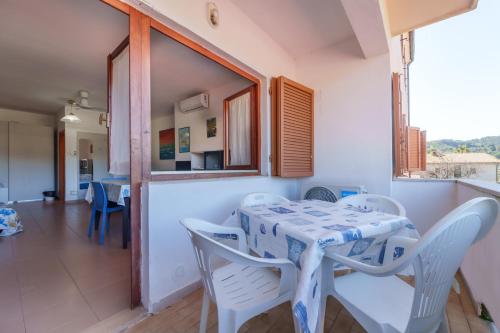 a dining room with a table and chairs at Appartamenti Gli Orizzonti - Goelba in Marina di Campo