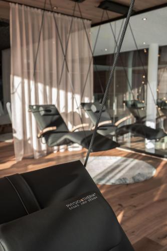 a group of chairs sitting in a room at Wellness & Naturhotel Tonihof in Langdorf im Landkreis Regen