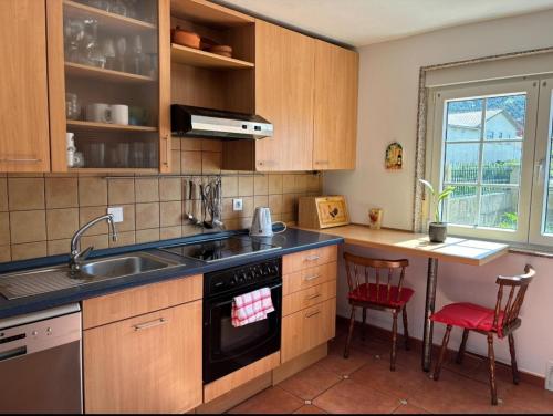 a kitchen with a sink and a stove at Carnota Beach in Carnota