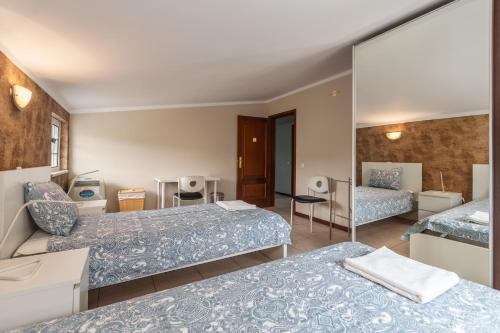 En eller flere senge i et værelse på Casa Azul Belgica, Fiscal