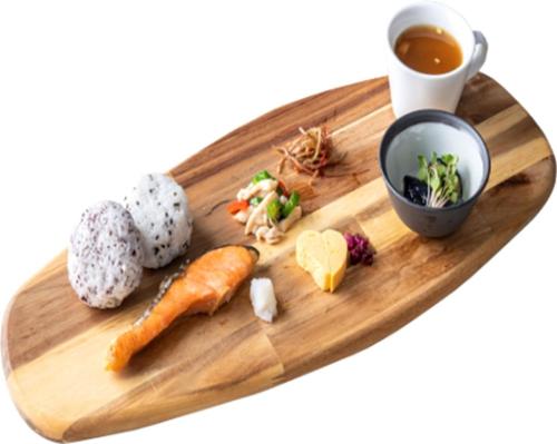 a wooden board with food and a cup of tea at Kashiba Hotel Flower Style (Adult Only) in Kashiba