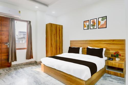 Postel nebo postele na pokoji v ubytování Super Hotel O The Param continental