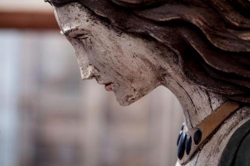 a close up of the side of a wooden bench at Casa Galos Hotel & Lofts in Valparaíso