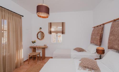 Postel nebo postele na pokoji v ubytování Onar Sifnos Traditional Villa