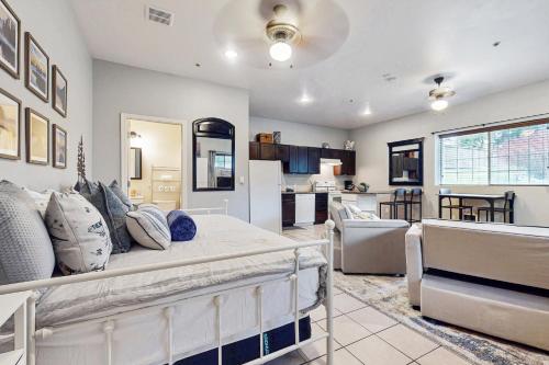 a living room with a couch and a kitchen at The Cozy Nook in Bonney Lake