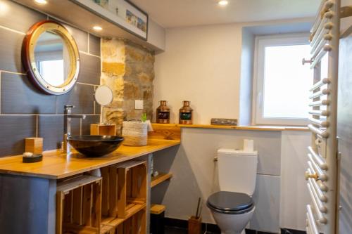a bathroom with a sink and a toilet at Ty Grégoire - Campagne - Wi-Fi in Crozon