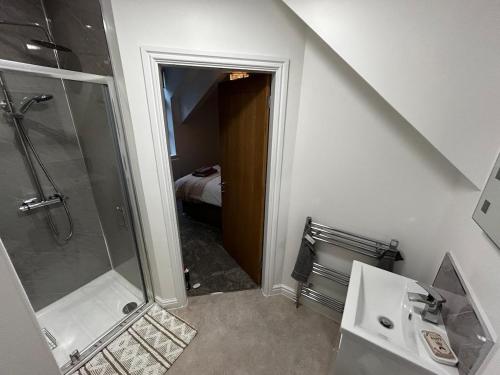 a bathroom with a shower and a sink and a toilet at Entire home in Eccleshall in Eccleshall