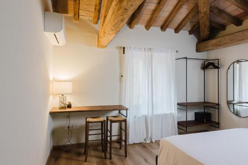 Ένα ή περισσότερα κρεβάτια σε δωμάτιο στο Locanda sul fiume