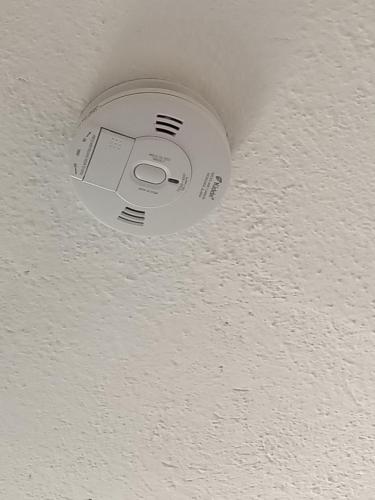 a ceiling light with a camera on a ceiling at il telaio sardo Bonarcado in Bonarcado