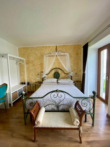 a bedroom with a large bed with a canopy at B&B Nest on the Lake in Lezzeno