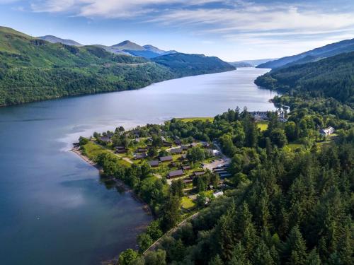 an aerial view of a lake in the mountains at Ardgartan Argyll Cabins - Forest Holidays in Arrochar
