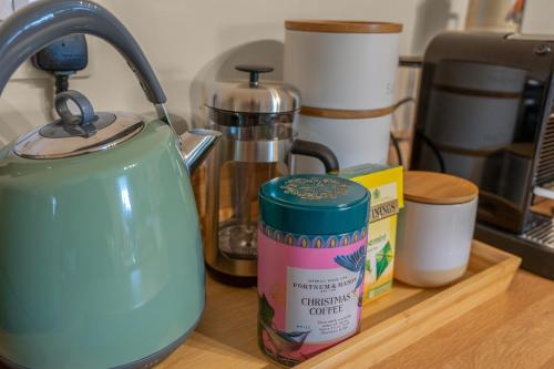 a teapot sitting on a counter next to a counter top at 2 bed period Victorian property in historic town in Haddington