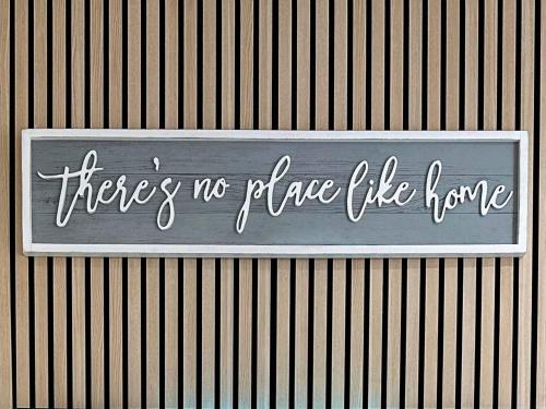 a sign that says thereres no place like home at On Trend 3 Bedroom Home In Maerdy Near Attractions in Maerdy