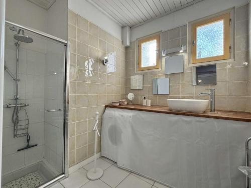 a bathroom with a shower and a sink and a glass shower stall at Maison rénovée à Saint-Georges-d'Oléron, 6 pers, proche pistes cyclables - FR-1-246A-344 in Saint-Georges-dʼOléron