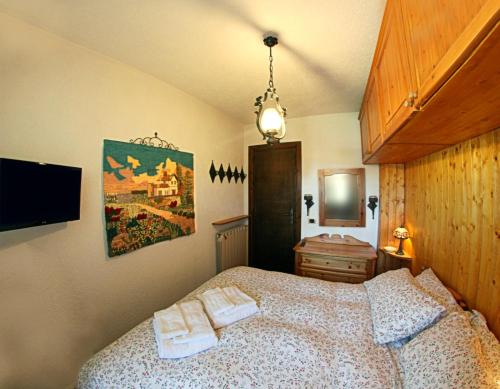 Postel nebo postele na pokoji v ubytování ROCCARASO CENTRO - Casa con 6 posti letto e Self Check-in vicino al palaghiaccio