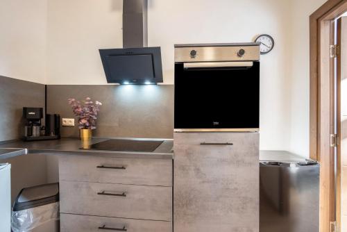 a kitchen with a sink and a stove at Altstadt Residenz in Lübeck