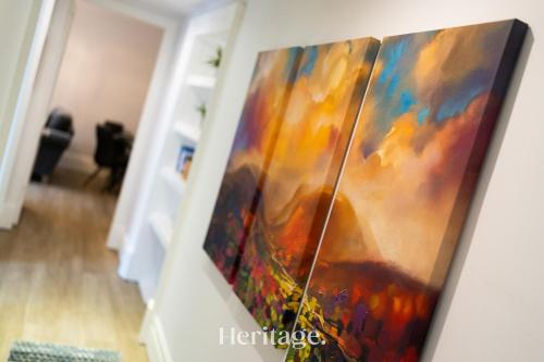 a painting hanging on a wall in a room at The Copper Loft Apartment, Keith in Keith