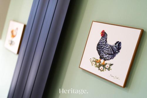 a picture of a chicken on a wall at The Copper Loft Apartment, Keith in Keith
