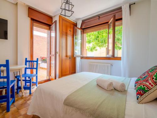Un ou plusieurs lits dans un hébergement de l'établissement Oliva Rooms 3000