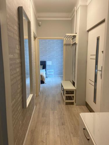 a hallway with a room with a bed and a mirror at Apáczai Apartment nearby Chain Bridge in Budapest