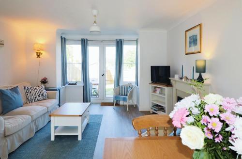 a living room with a couch and a table at 28 Anchorage Way in East Cowes