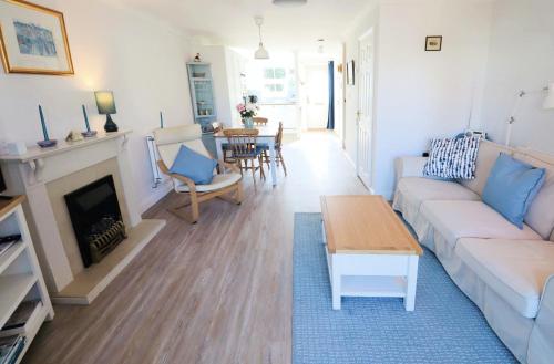 a living room with a couch and a table at 28 Anchorage Way in East Cowes