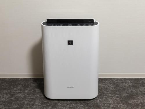 a cell phone sitting on top of a white refrigerator at Kyoto Plaza Hotel Kintetsu Jujo in Kyoto