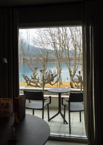 a view of a table and chairs from a window at APARTAMENTS LA CARPA in Banyoles