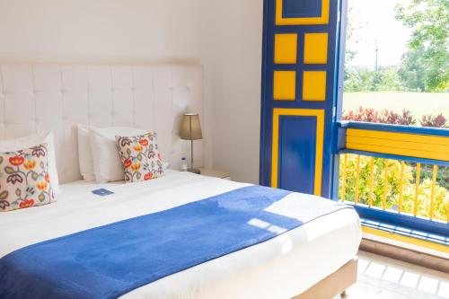 La Herencia Hotelにあるベッド