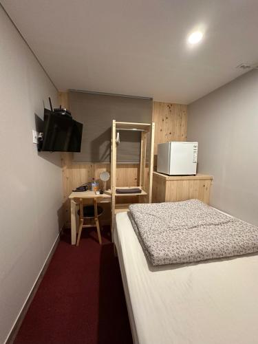 Katil atau katil-katil dalam bilik di Insadong R Guesthouse