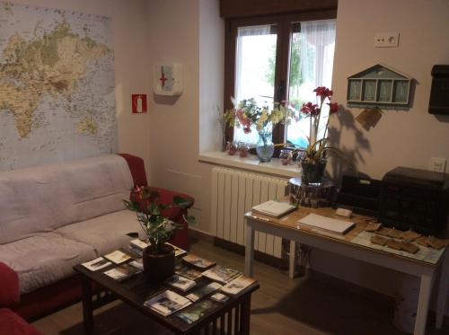 a living room with a couch and a table at La Casa de los Soportales in Mansilla de las Mulas