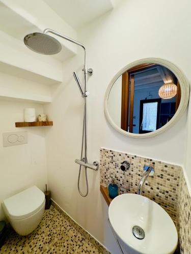 a bathroom with a sink and a mirror at Amoredimare Casa Vacanze in Polignano a Mare