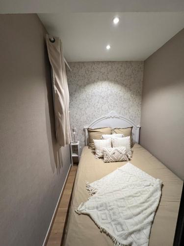 Ein Bett oder Betten in einem Zimmer der Unterkunft Le COSY