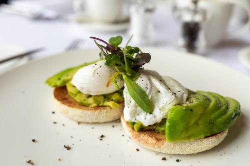 a sandwich with eggs and pickles on a plate at Kilkea Castle in Kilkea