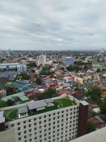 a view of a city from the top of a building at The Orabella 27F Chill Zone with a View in Manila