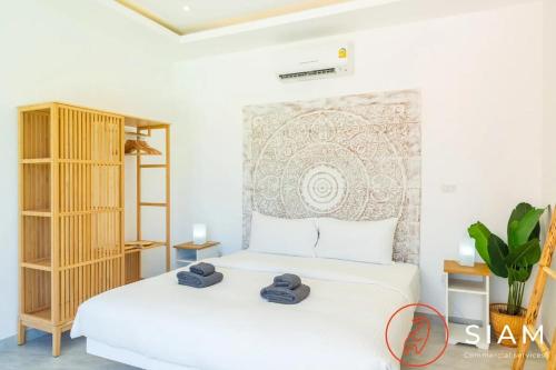 Ένα ή περισσότερα κρεβάτια σε δωμάτιο στο Villa Laura 2br & Private Pool