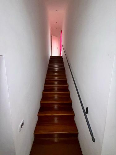 a stairway with a red light at the top at Da Zi Fabiola alla stazione in Velletri