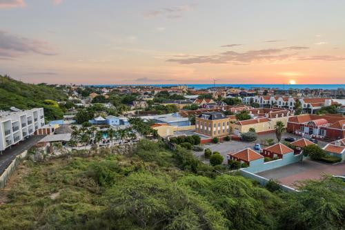 an aerial view of a city at sunset at The Ritz Village in Willemstad