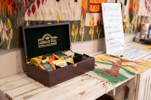 a box of food on a table next to a laptop at Mangroovy Seafront condo - Great Kite Surfing in Hurghada