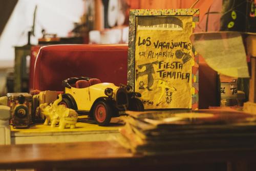 a toy car sitting on a table next to a box at Casa Almarita - Hostal, Bar y Restaurante in Medellín