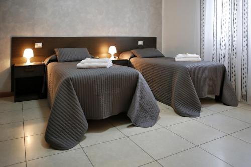 Posteľ alebo postele v izbe v ubytovaní B&B Il Sasso Antico