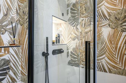 a bathroom with a shower with a glass door at La Cattedrale in La Spezia