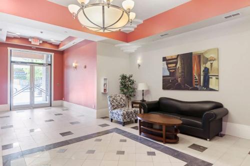 a living room with a couch and a table at Brooklyn Arts Condo in Wilmington