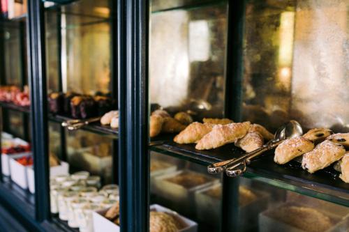a display case in a bakery with pastries and bread at Kilkea Castle in Kilkea