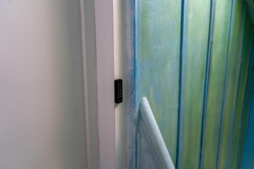 a close up of a door with a shower curtain at Rheinfall Living in Neuhausen am Rheinfall