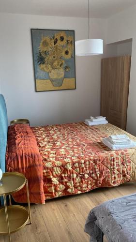 a bedroom with a bed and a picture on the wall at Casa Matilde in Sanremo
