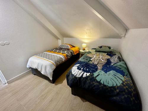 Un ou plusieurs lits dans un hébergement de l'établissement Ti Kaz Coco Passion Vue Mer