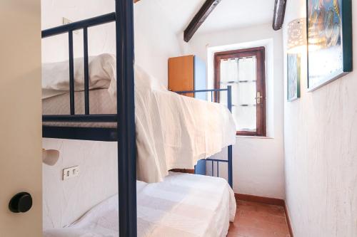 Ένα ή περισσότερα κρεβάτια σε δωμάτιο στο Casa Mucchi Bianchi PC33